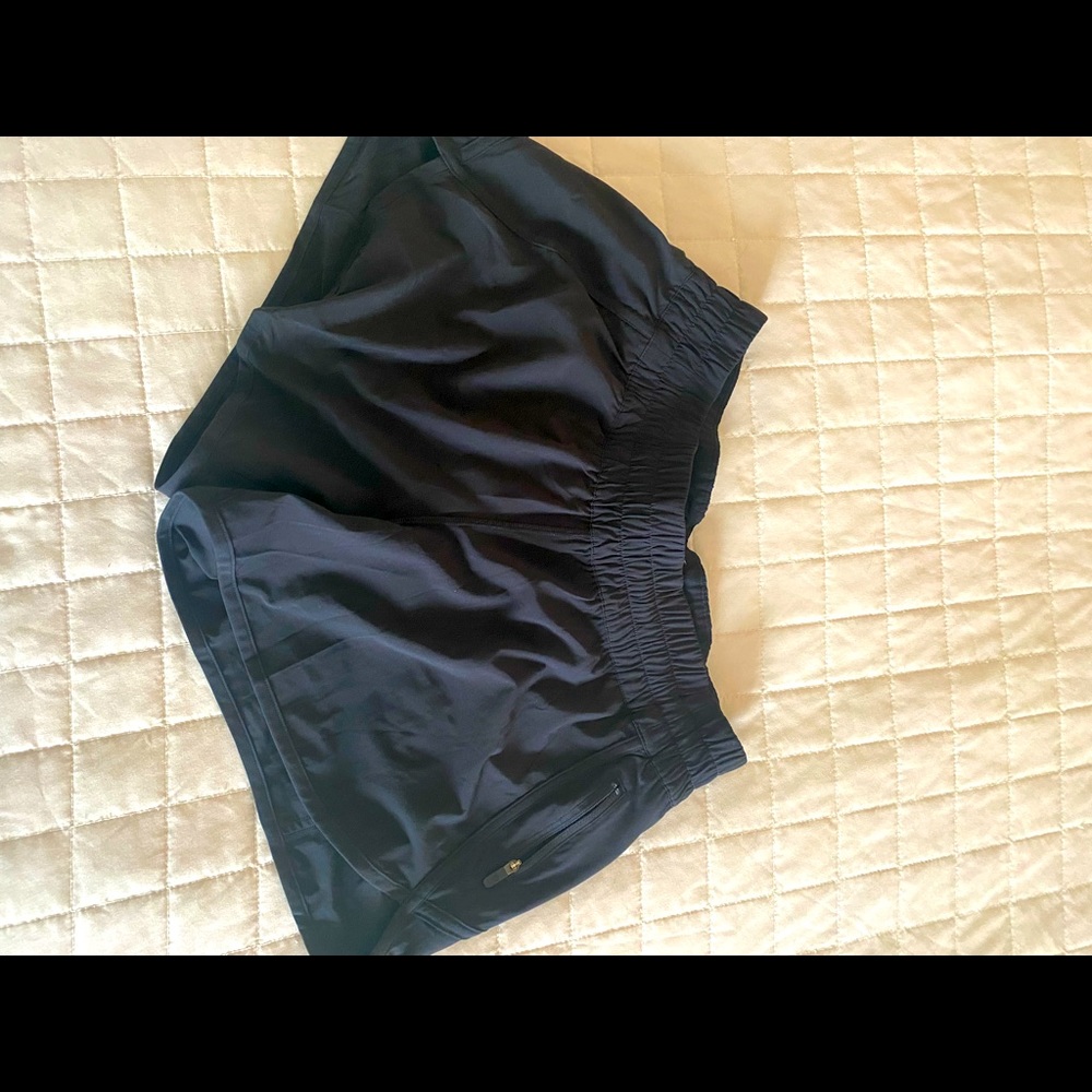 Like new Lululemon black shorts. 4” low rise